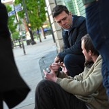 Mayor of Greater Manchester, Andy Burnham, speaks to a homeless person in Manchester city centre