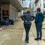 Mayor of Greater Manchester, Andy Burnham watching staff caring for a homeless person in Manchester city centre