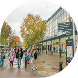 People walking outside Mill Side shopping centre, Bury