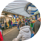 People shopping in an indoor market